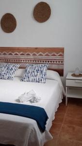 Giường trong phòng chung tại El Pez Naranja
