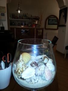 a glass bowl filled with different types of rocks at Hotel Argentina in Santa Margherita Ligure