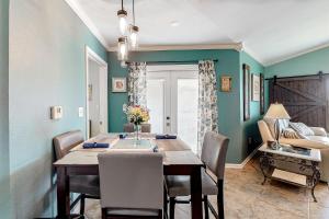 a dining room with a table and chairs at Colony Club in Gulf Shores