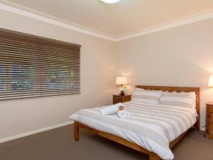 A bed or beds in a room at Bluewater - riverfront location with water views