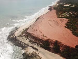 an aerial view of a beach next to the ocean at Paua Hotel Boutique in Pipa