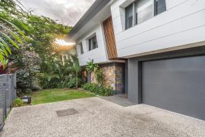 a garage door in front of a house at Foam in Byron Bay