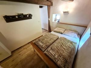 Postel nebo postele na pokoji v ubytování Holidayfarm Natural Slovakia - Holidayhouse Ranná Rosa