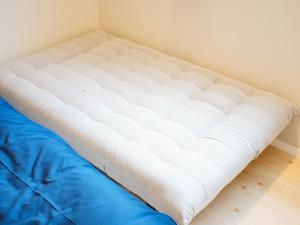Postel nebo postele na pokoji v ubytování Mcity in Furujima