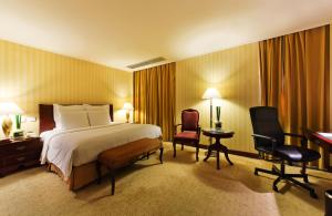 Postel nebo postele na pokoji v ubytování Clarion Hotel Tianjin
