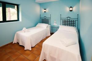 Postel nebo postele na pokoji v ubytování Hospedium Hotel La Parada del Compte