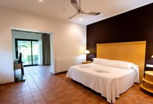 Postel nebo postele na pokoji v ubytování Hospedium Hotel La Parada del Compte