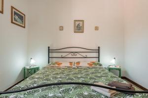 מיטה או מיטות בחדר ב-Villa Loredana