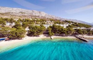 an aerial view of a beach with blue water at Holiday Village Sagitta - Light All Inclusive in Omiš