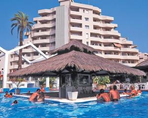 a group of people in the swimming pool at a hotel at benal beach 81 in Benalmádena