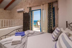 Postel nebo postele na pokoji v ubytování Astarte Villas - Beach Villa Nout