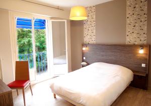 Postel nebo postele na pokoji v ubytování Hotel les Pecheurs