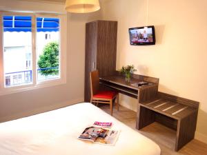 Postel nebo postele na pokoji v ubytování Hotel les Pecheurs