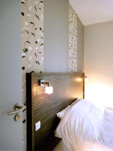 Postel nebo postele na pokoji v ubytování Hotel les Pecheurs
