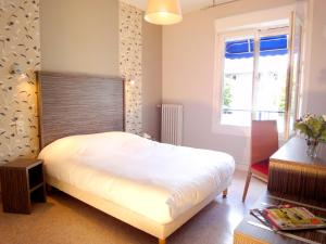 Postel nebo postele na pokoji v ubytování Hotel les Pecheurs
