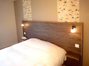Postel nebo postele na pokoji v ubytování Hotel les Pecheurs