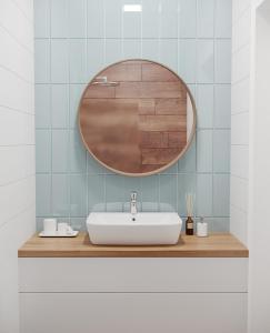 a bathroom with a sink and a mirror at Green City Apartment in Tashkent