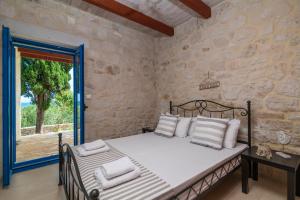 Postel nebo postele na pokoji v ubytování Astarte Villas - Beach Villa Nout + 25 fotografií