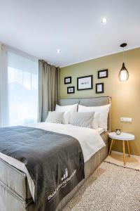 Ένα ή περισσότερα κρεβάτια σε δωμάτιο στο Business Hotel Maier