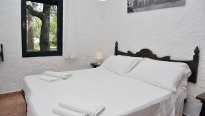 Een bed of bedden in een kamer bij Welcomely - Villa Adele