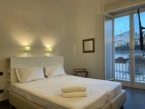 Postel nebo postele na pokoji v ubytování Jazz Hotel