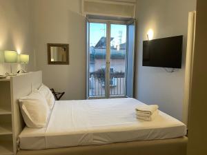 Postel nebo postele na pokoji v ubytování Jazz Hotel