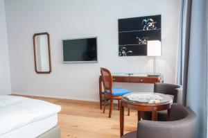 TV o dispositivi per l'intrattenimento presso Romantik Hotel Beau Rivage Weggis