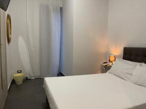 Postel nebo postele na pokoji v ubytování Jazz Hotel