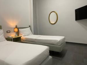 Postel nebo postele na pokoji v ubytování Jazz Hotel