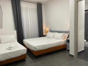 Postel nebo postele na pokoji v ubytování Jazz Hotel