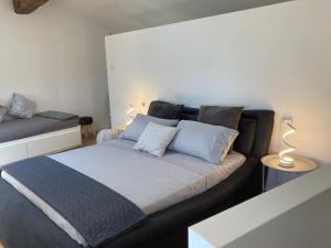 a bedroom with a bed and a couch at ON the RAIL by Arcotrilogy-Homes in Arco
