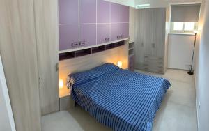 A bed or beds in a room at Alba Serena