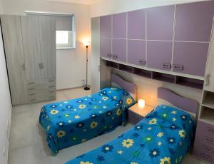 A bed or beds in a room at Alba Serena