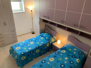 A bed or beds in a room at Alba Serena