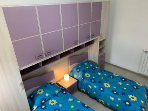 A bed or beds in a room at Alba Serena