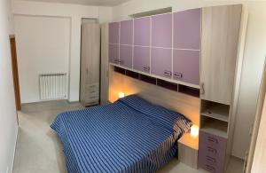 A bed or beds in a room at Alba Serena