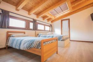 Llit o llits en una habitació de Lovely house in the most peacefull place of Grado