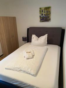 Postel nebo postele na pokoji v ubytování Ferienwohnung Siegen Eiserfeld 3