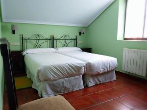 Llit o llits en una habitació de Hotel Rural El Otero