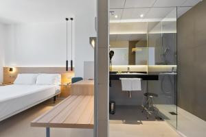 מיטה או מיטות בחדר ב-Hotel Areca