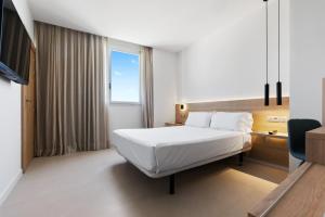 מיטה או מיטות בחדר ב-Hotel Areca