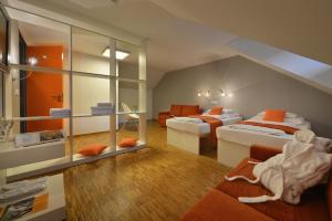 Postel nebo postele na pokoji v ubytování Omnia Hotel Relax & Wellness