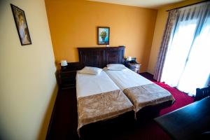 Postel nebo postele na pokoji v ubytování Hotel Clasic