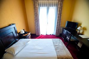 Postel nebo postele na pokoji v ubytování Hotel Clasic