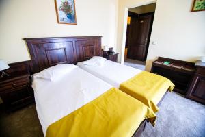 Postel nebo postele na pokoji v ubytování Hotel Clasic