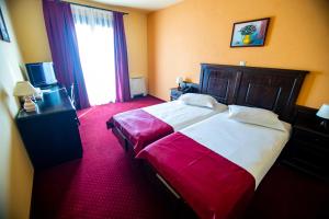 Postel nebo postele na pokoji v ubytování Hotel Clasic