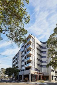 a rendering of a white apartment building at Astina Suites, Penrith in Penrith