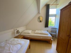 Postel nebo postele na pokoji v ubytování Hello Zeeland - Vakantiehuis Zwin 019