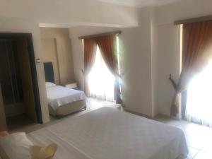 Postel nebo postele na pokoji v ubytování Hamle Hotel