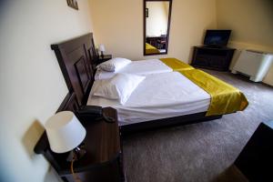 Postel nebo postele na pokoji v ubytování Hotel Clasic